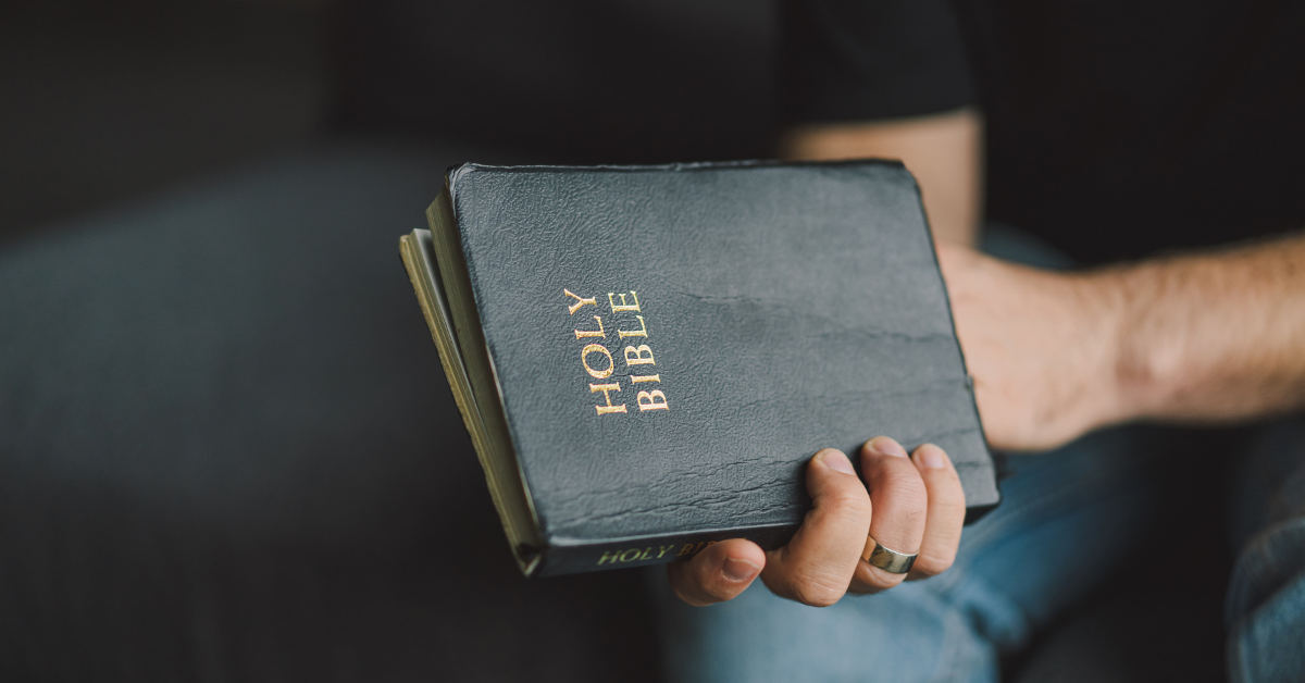 Man holding a Bible in his hands