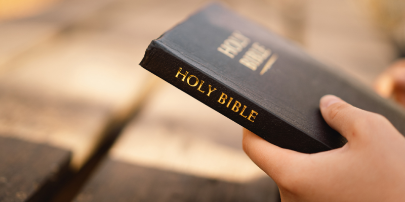 Man holding a Bible